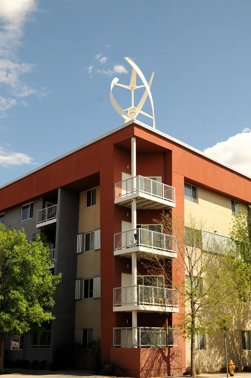 View of white, winding sculpture on the corner of the roof of the Silver Gardens building in Albuquerque