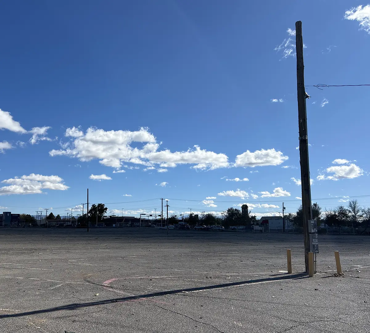 Parking lot and telephone pole at the site of the future West Mesa Ridge A building.